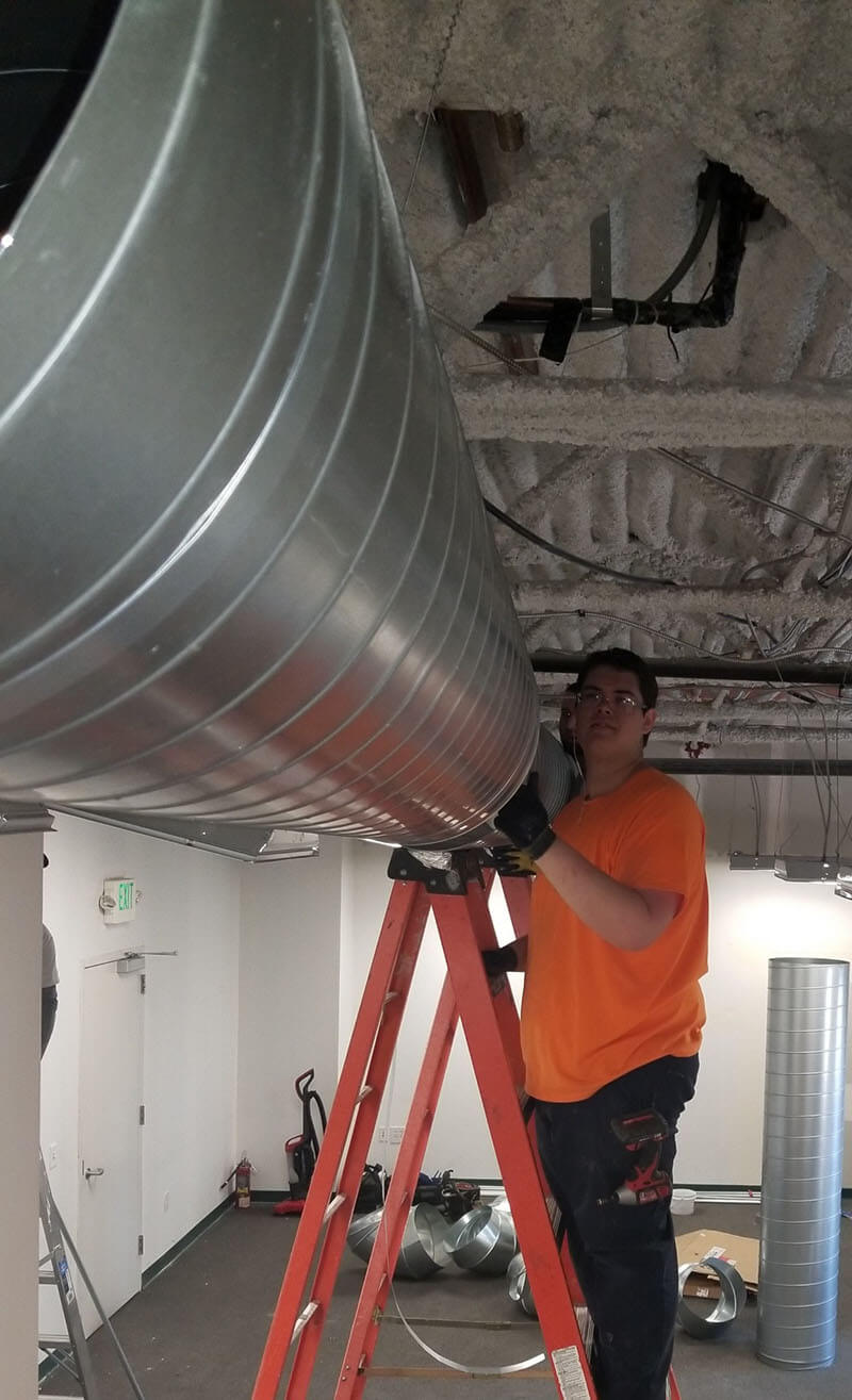 hanging exposed duct in recreation office